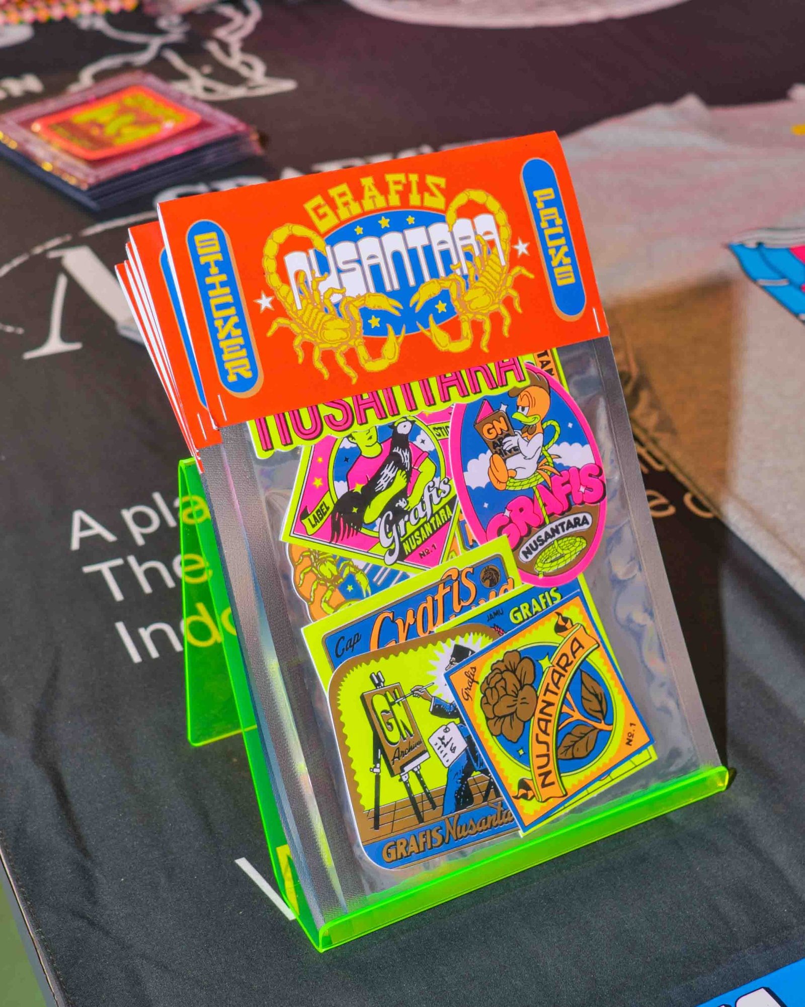 Grafis Nusantara's merchandise, featured during the book launch and showcase (Aan, Grammars, 2025)