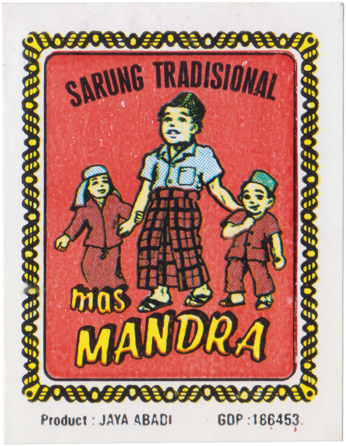 [Fig.1] This printed paper label from the Grafis Nusantara Collection features the Sarung Tradisional by Mas Mandra, Jaya Abadi. The design depicts a man in a checked sarung holding hands with two children, one in a peci and the other in a headscarf, framed by a black-and-yellow rope border, illustrating the sarung as part of a typical family outing.